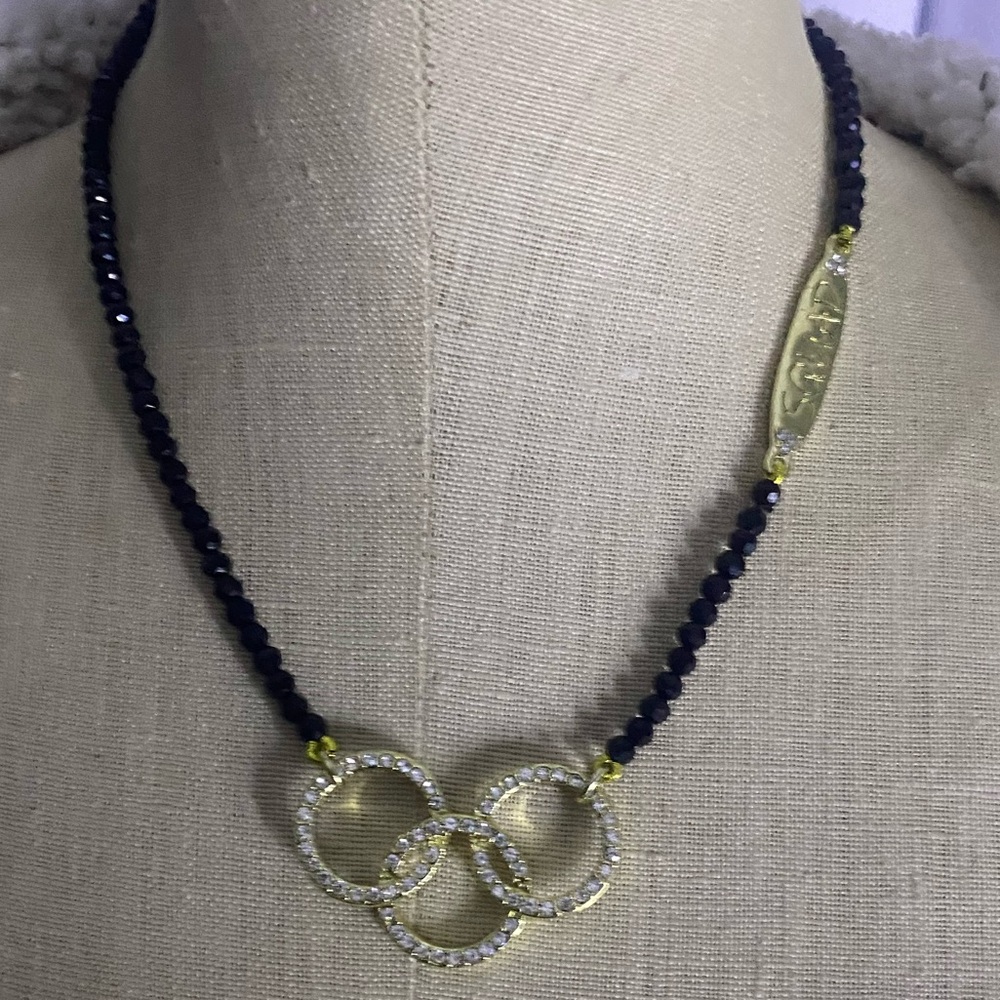 Heidi DAUS 3 Crystal circles jet black beads with a tag that says SQUAD. Unique